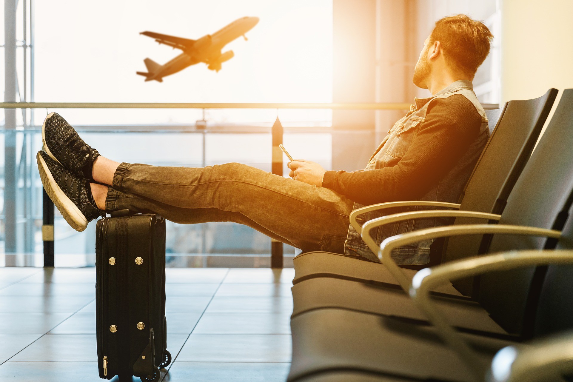 man sitting in airport lounge