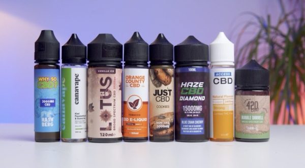 Different CBD e-liquids on a table