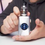 Aiden holding the Vaporesso Gen Max for a review