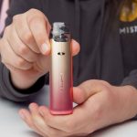 Photo of Aiden holding a Voopoo VMATE i2