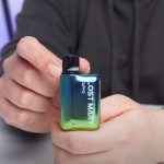 Aiden from MIST UK holding a prefilled vape