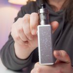 Aiden from MISt holding a Voopoo Vinci Spark 100 kit for a review