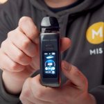 Aiden from MIST holding a Digi Max R Geekvape vape