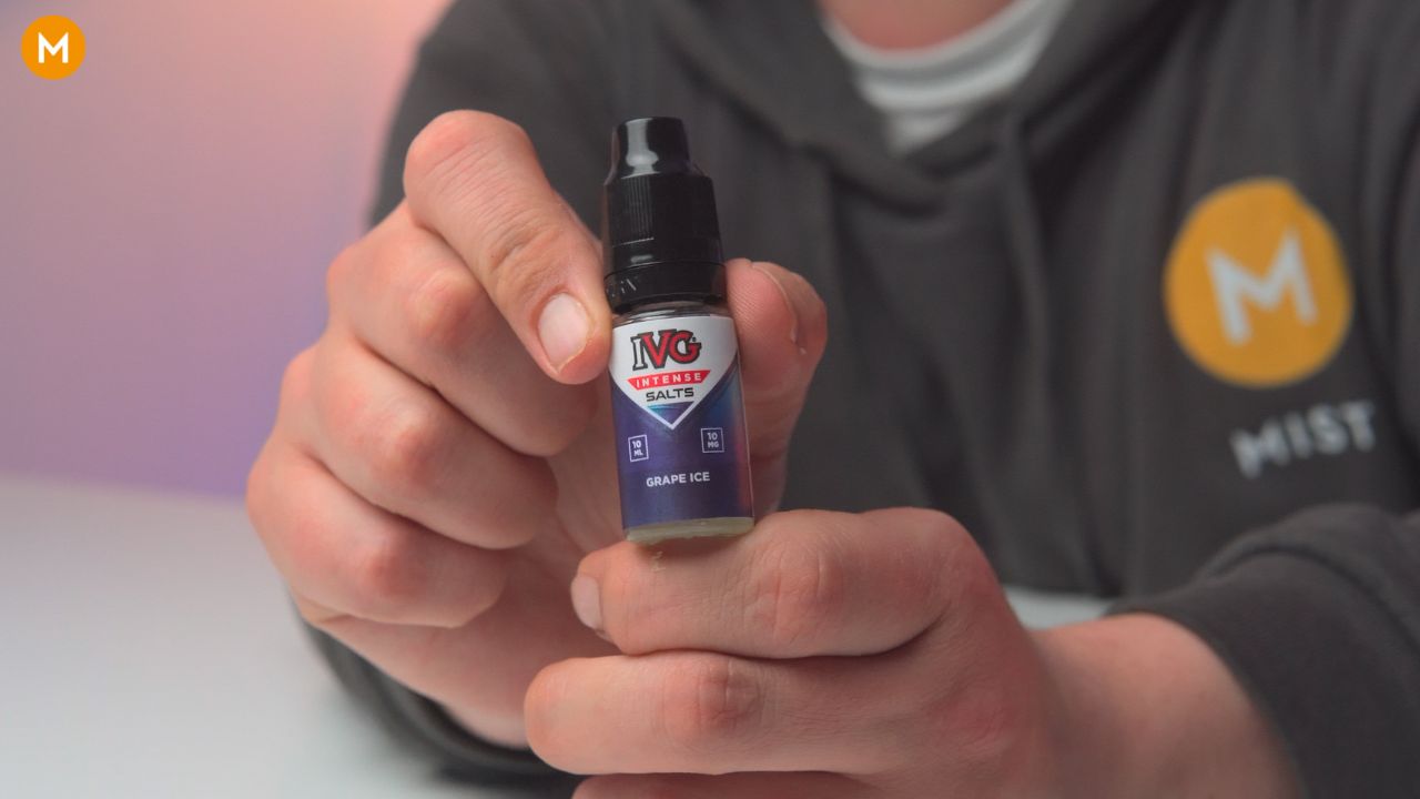 Aiden holding a bottle of IVG Intense Salts grape ice