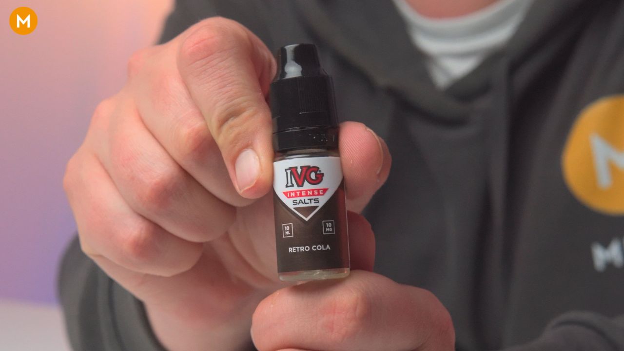 Aiden holding a bottle of IVG Intense Salts retro cola