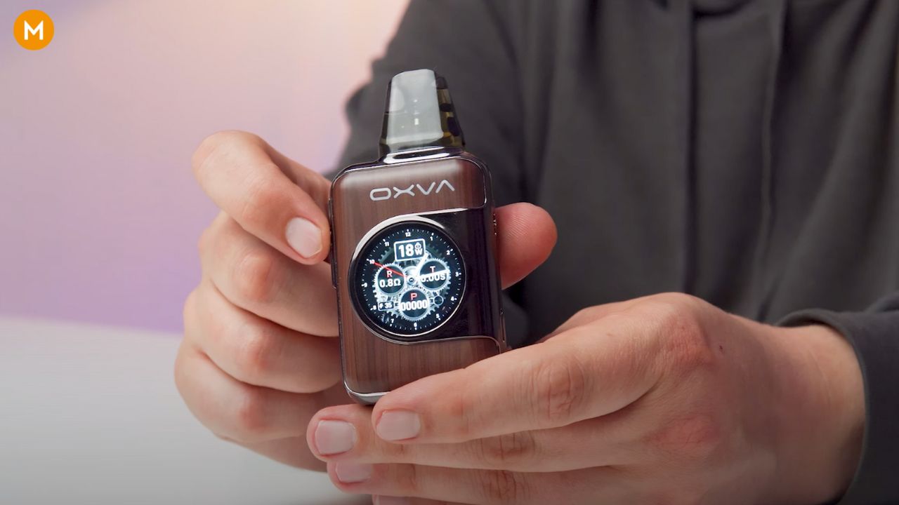 Aiden from MIST holding an OXVA XLIM SQ Pro 2