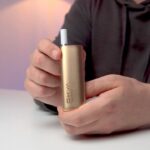 Aiden from MIST UK holding the OXVA Slimstick for a review